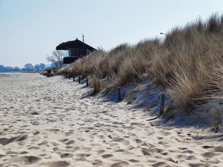 Foto haus am strand vor klarem himmel