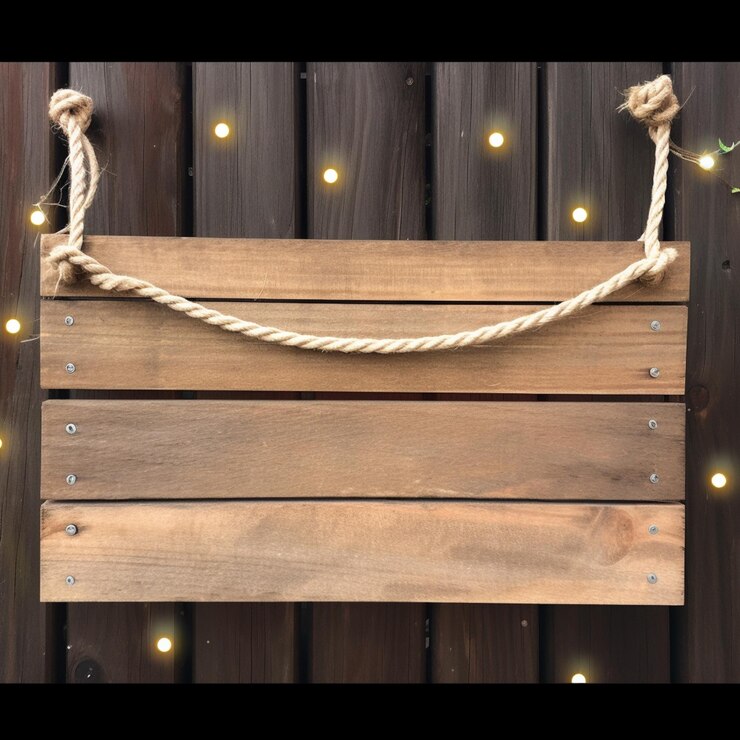 Foto hay un letrero de madera colgando de una cuerda con luces en el fondo generativo ai