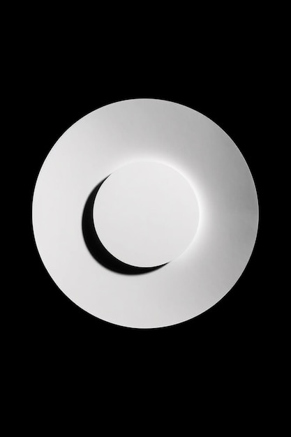 Hay una placa blanca con un fondo negro y un objeto circular blanco generativo ai