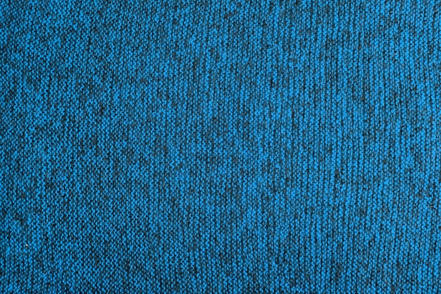 Hellblaue und schwarze Melange-Strickstruktur und flacher Hintergrund