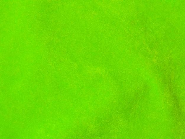 Hellgrüne samtige Stoffstruktur als Hintergrund verwendet Leerer grüner Stoffhintergrund aus weichem und glattem Textilmaterial Es gibt Platz für Text
