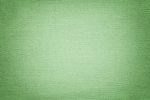 Hellgrüner Hintergrund von einem Textilmaterial.