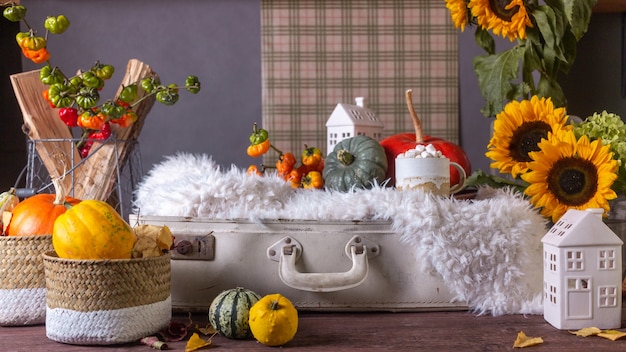 Foto herbststillleben mit kürbissen und plaids