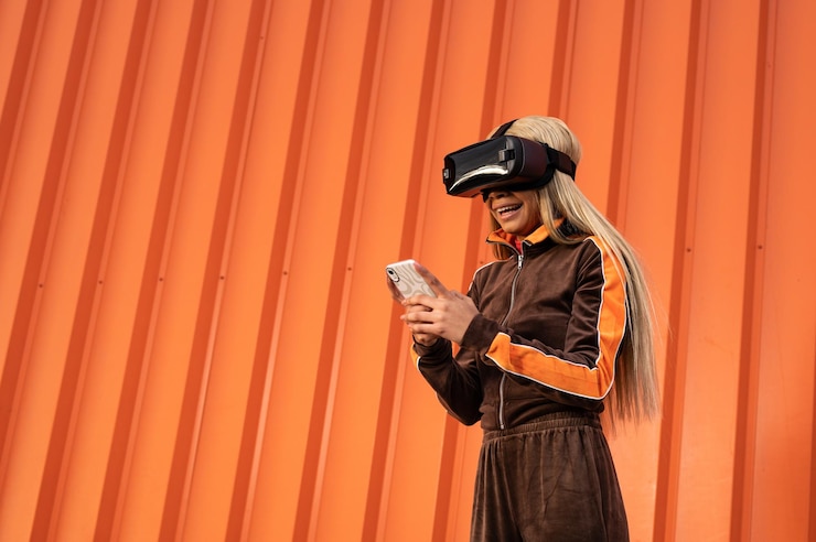 Foto una hermosa mujer afroamericana usando gafas de realidad virtual sobre un fondo naranja