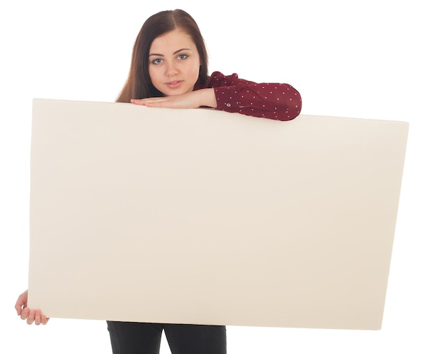 Foto una hermosa mujer toma un lienzo contra un fondo blanco.