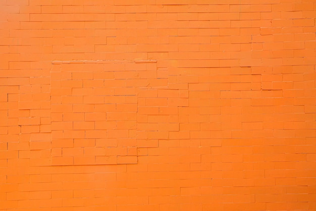 hermosa pared de fondo naranja con patrón de ladrillo pequeño