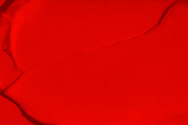 Hermosa textura de un rico color rojo brillante Color escarlata Textura de lápiz labial sombra de ojos pintura líquida mancha roja mancha mate