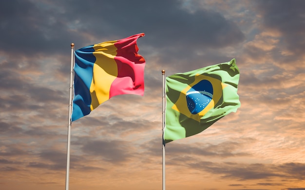 Hermosas banderas del estado nacional de Brasil y Chad juntos en el cielo azul