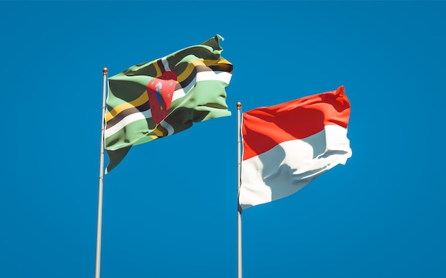 Hermosas banderas del estado nacional de Indonesia y Dominica juntos en el cielo azul