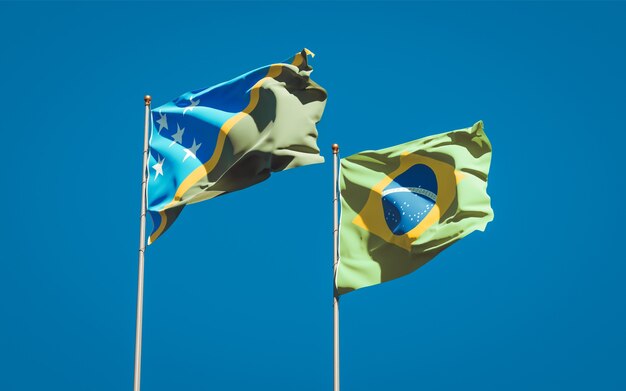 Hermosas banderas del estado nacional de las Islas Salomón y Brasil juntos en el cielo azul