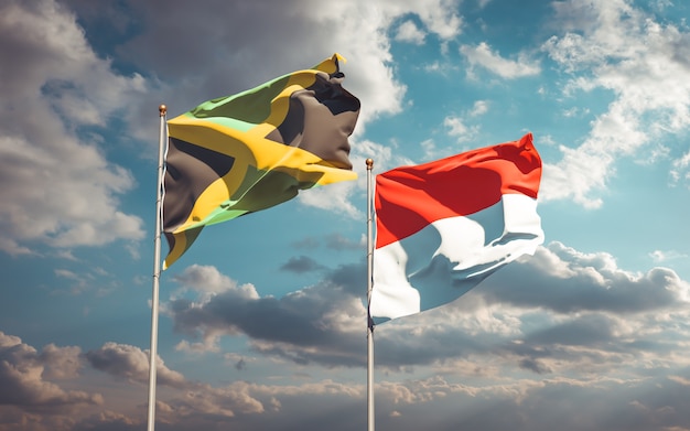 Hermosas banderas del estado nacional de Jamaica e Indonesia juntos en el cielo azul