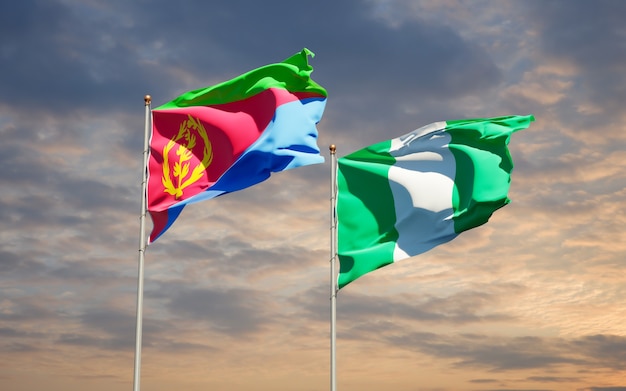 Hermosas banderas del estado nacional de Nigeria y Eritrea juntos en el cielo azul