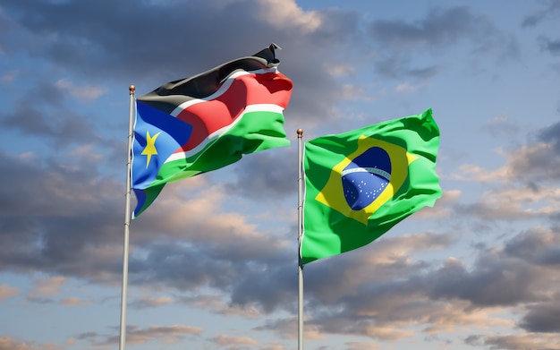 Hermosas banderas del estado nacional de Sudán del Sur y Brasil juntos en el cielo azul