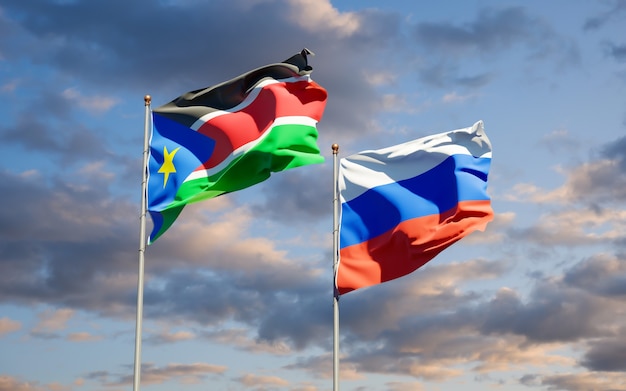 Hermosas banderas del estado nacional de Sudán del Sur y Rusia juntos en el cielo azul. Ilustraciones 3D