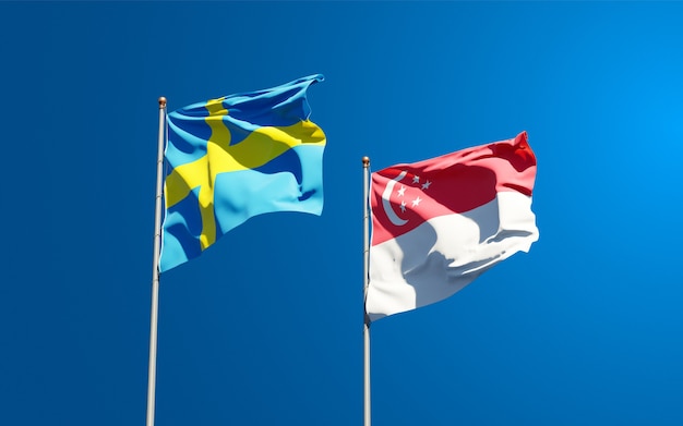 Hermosas banderas del estado nacional de Suecia y Singapur juntos