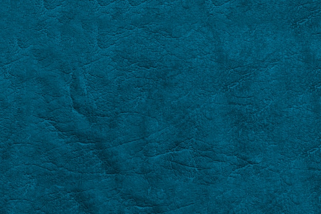 Hermoso fondo azul de cuero genuino. Superficie de textura con un patrón.