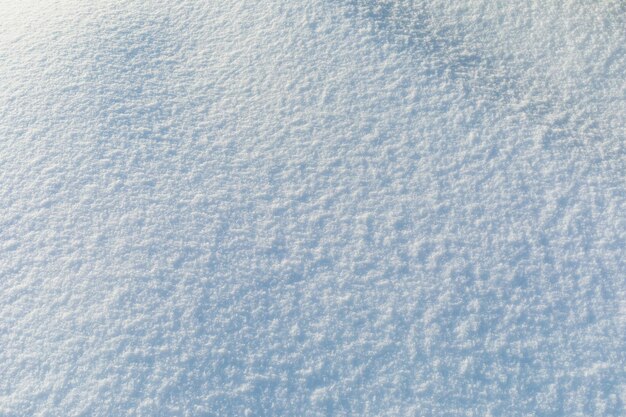 Hermoso fondo de nieve con la luz del sol