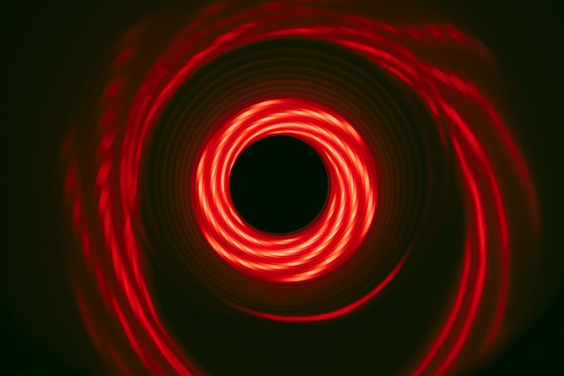hermoso túnel de remolino abstracto con luz de neón roja en un fondo pttern texturizado para deisgn