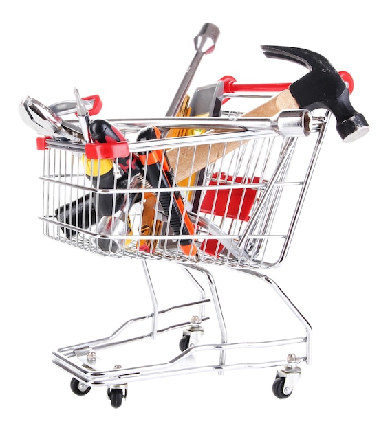 Herramientas de construcción en el carrito de compras aisladas en blanco