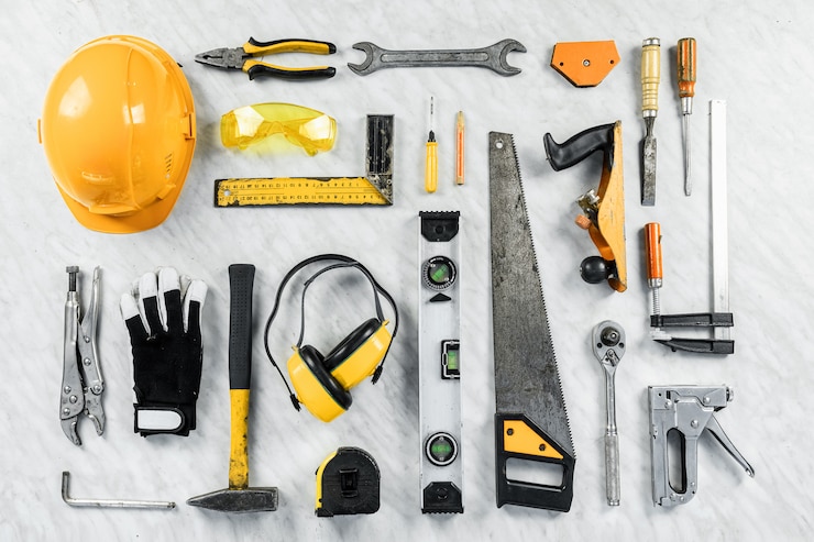 Foto herramientas de construcción sobre un fondo blanco. una colección de herramientas de construcción. construcción, reparación.