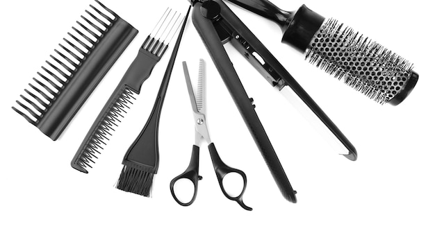 Foto herramientas de peluquería profesionales aisladas en blanco