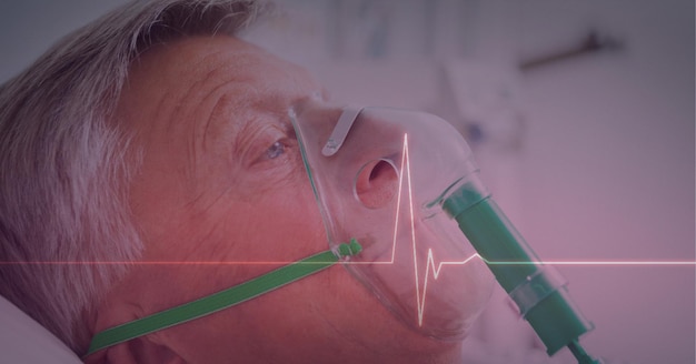 Herzfrequenzmesser gegen männlichen älteren Patienten mit Sauerstoffmaske