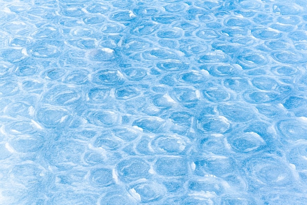 Hielo coloreado Textura abstracta del hielo Fondo de la naturaleza Patrones de hielo marino en el hielo