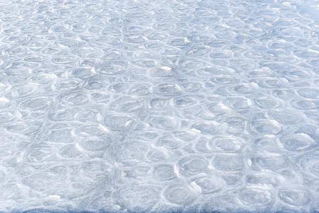 Hielo coloreado Textura abstracta del hielo Fondo de la naturaleza Patrones de hielo marino en el hielo