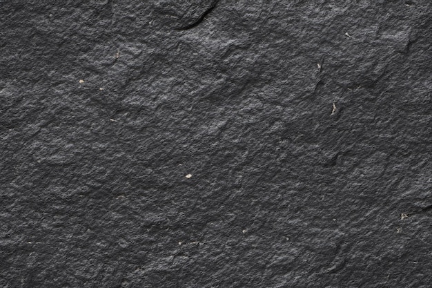 Hintergrund auf schwarzer Steinoberfläche