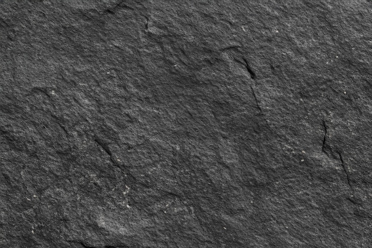 Foto hintergrund auf schwarzer steinoberfläche