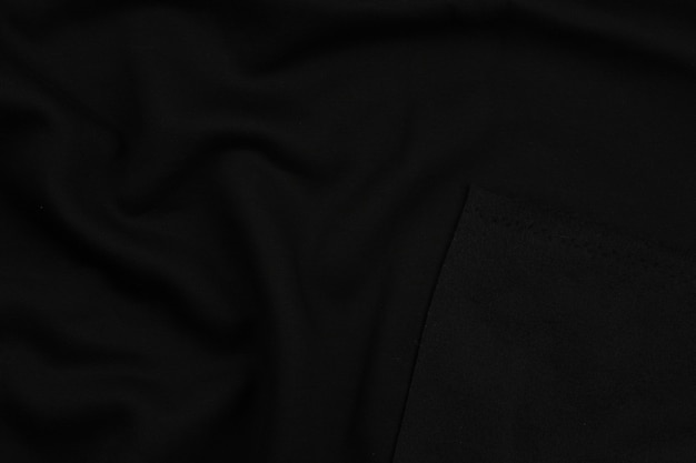 Hintergrund aus schwarzem monochromem Baumwollgewebe Nahaufnahme Textur