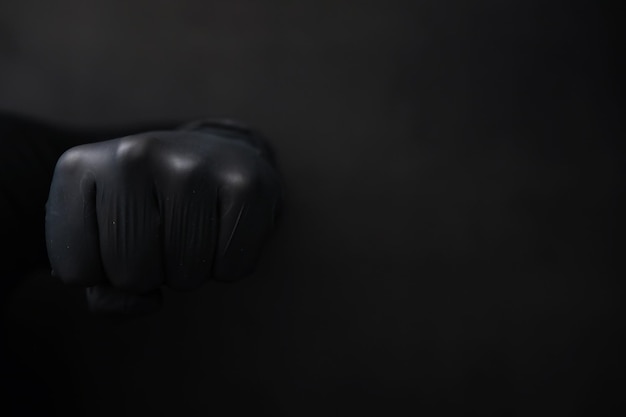 Hintergrund der Hände in Handschuhen Schwarze Handschuhe Handgesten in schwarzen Handschuhen