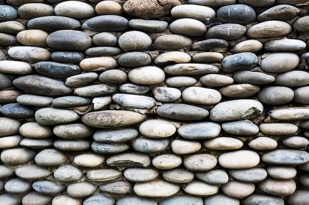 Hintergrund der mit Steinen gepflasterten Mauer.