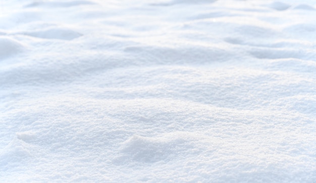 Hintergrund der Neuschneebeschaffenheit, Winterschneelandschaft. Selektiver Fokus