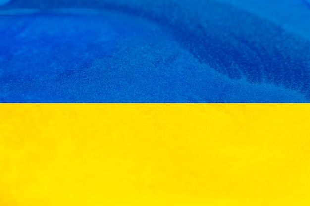 Foto hintergrund der ukrainischen flagge demokratie freiheit ukrainischer patriotismus nationales symbol blaue gelbe farbe zwei horizontale bänder bokeh leichte körnung mit leerem raum