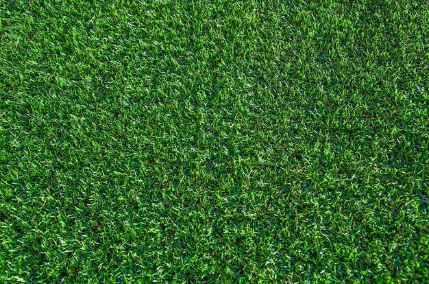 Hintergrund des grünen Grases. Rasen, Fußballplatz, Kunstrasen aus grünem Gras, Textur, Ansicht von oben