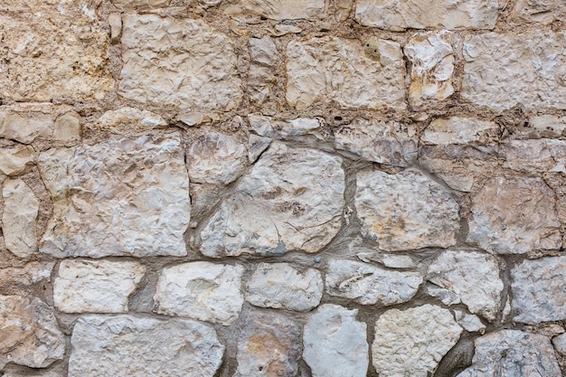 Hintergrund des natürlichen alten Steinziegels einer alten Burg, Hecke.