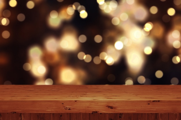 Hintergrund des Weihnachten 3D mit Holztisch gegen defocussed bokeh Lichter