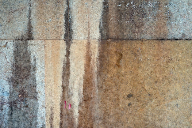 Hintergrund einer alten schmutzigen, strukturierten Steinmauer