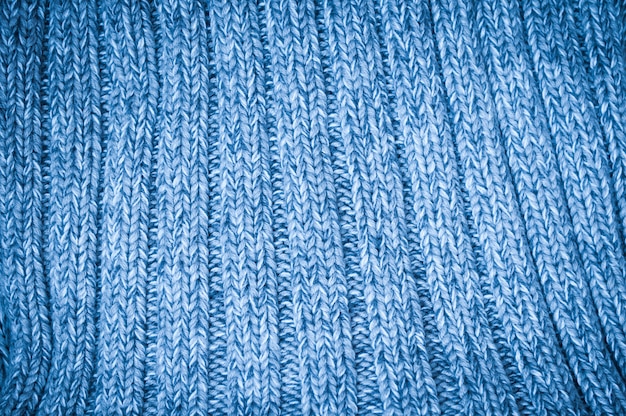 Hintergrund mit blauem gestricktem woolen gewebe