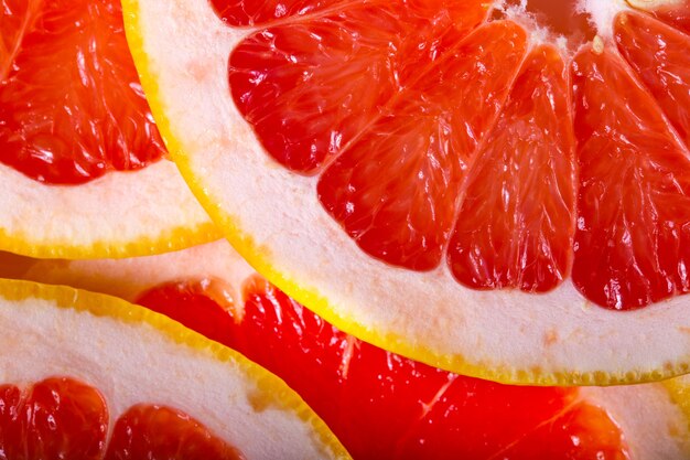 Hintergrund mit einem Haufen geschnittener Grapefruits