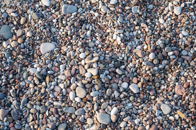 Hintergrund von bunten Kieselsteinen am Meeresstrand hautnah horizontale Ausrichtung
