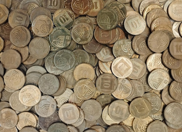 Hintergrund von metallischen Münzen Israelischer Schekel selektiver Fokus
