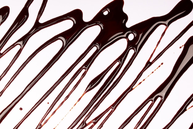 Hintergrund von Spritz- und Fließtropfen von Schokolade