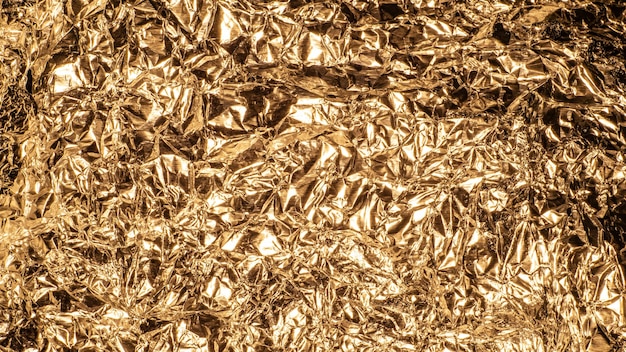 Hintergrund zerknitterte metallische Goldfolie