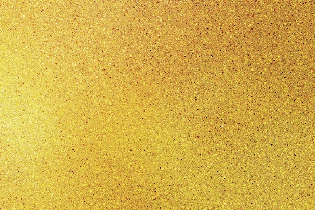 Hintergrundfoto Licht von texturierten Goldglitzern