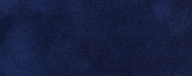 Hintergrundmakro aus marineblauem Wildlederstoff Samtmatte Textur aus dunklem Denim-Nubuk-Textil