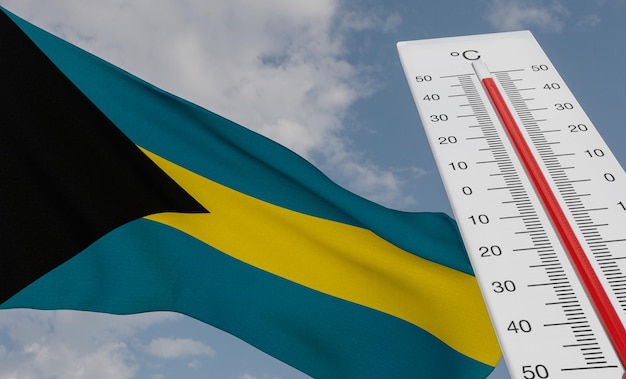 Hitzewelle auf den Bahamas Thermometer vor Flagge Bahamas und Hitzewelle im Himmelshintergrund