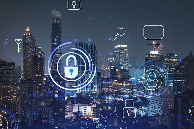 Holograma de candado brillante vista panorámica nocturna de la ciudad de Bangkok Sudeste Asiático El concepto de seguridad cibernética para proteger a las empresas Doble exposición