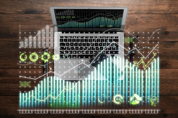 Holograma de gráfico financeiro, gráfico no laptop do escritório